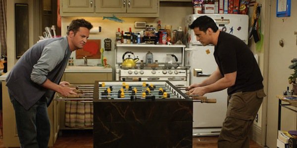 joey and chandler playing foosball